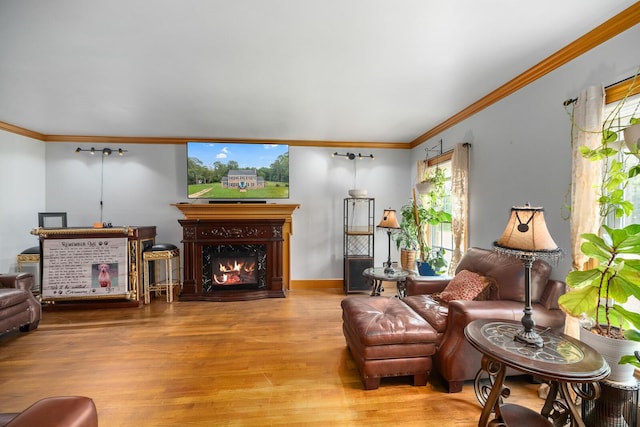 sitting room with wood-type flooring and ornamental molding