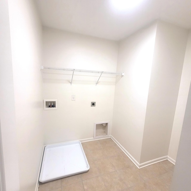 laundry room with laundry area, light tile patterned floors, baseboards, washer hookup, and electric dryer hookup