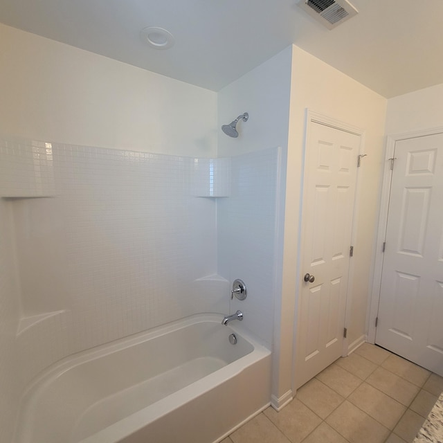 bathroom with shower / bath combination, visible vents, and tile patterned floors