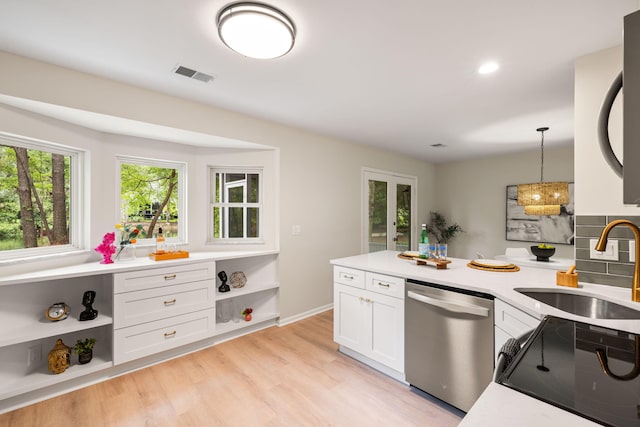 1478 Diamond Blvd, Mount Pleasant, SC 29466 - kitchen with stainless steel dishwasher, a peninsula, white cabinetry, light countertops, and recessed lighting