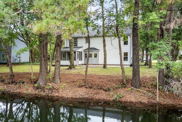 1478 Diamond Blvd, Mount Pleasant, SC 29466 - rear view of house featuring a sunroom, a water view, and a lawn