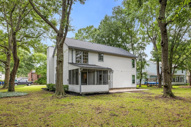 1478 Diamond Blvd, Mount Pleasant, SC 29466 - back of property featuring a sunroom, a yard, and a chimney