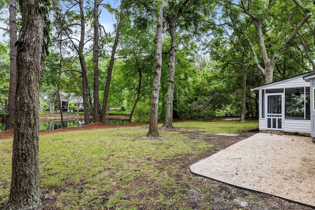 1478 Diamond Blvd, Mount Pleasant, SC 29466 - view of green lawn with a sunroom, a patio area, and a water view