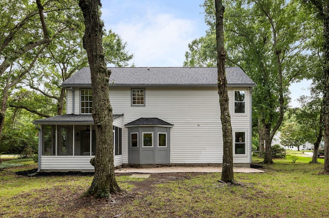 1478 Diamond Blvd, Mount Pleasant, SC 29466 - rear view of house with a sunroom, roof with shingles, and a lawn