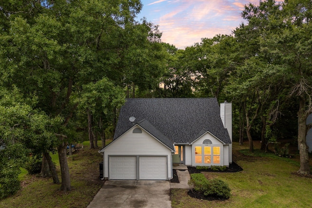1478 Diamond Blvd, Mount Pleasant, SC 29466 - view of front of house with a chimney, concrete driveway, a front yard, a shingled roof, and view of scattered trees