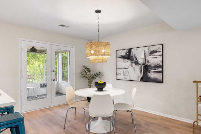 1478 Diamond Blvd, Mount Pleasant, SC 29466 - dining space featuring french doors, wood finished floors, and a chandelier
