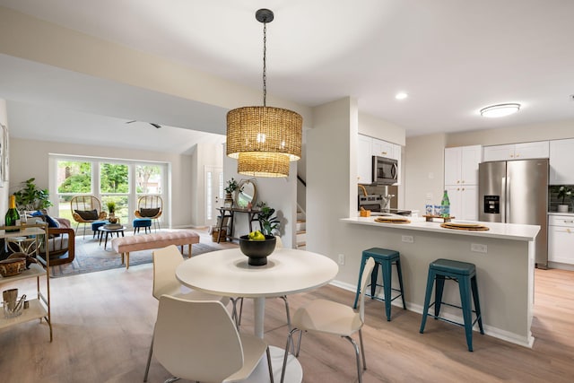 1478 Diamond Blvd, Mount Pleasant, SC 29466 - dining area with light wood-style flooring, recessed lighting, a chandelier, and stairs