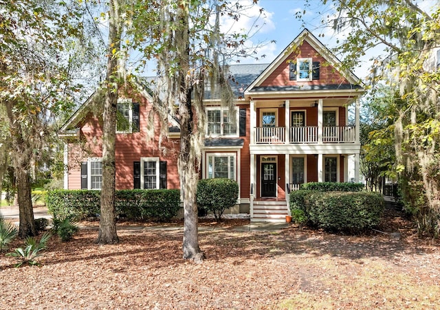 view of front of house featuring a balcony and covered porch