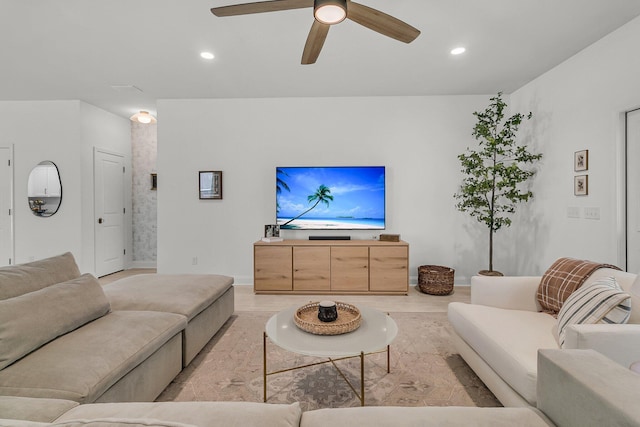 living area with recessed lighting, baseboards, ceiling fan, and light wood-type flooring