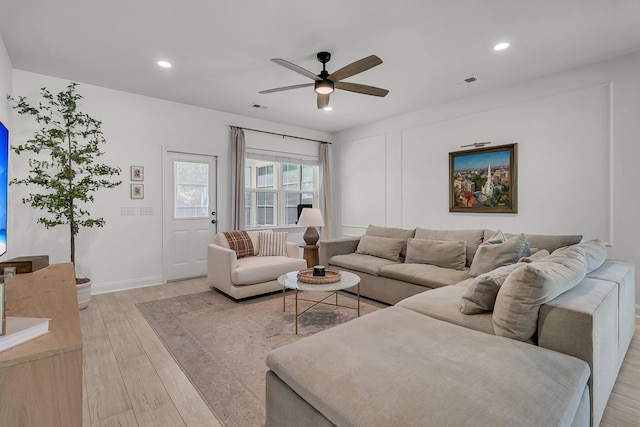 living area with recessed lighting, ceiling fan, visible vents, and light wood-type flooring