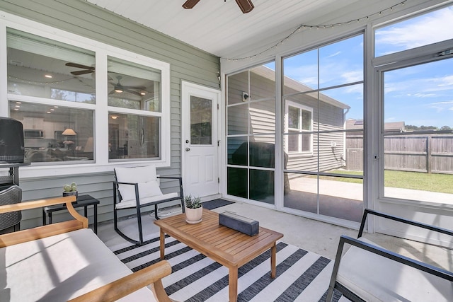 sunroom with ceiling fan and plenty of natural light