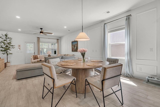 dining room featuring ceiling fan, visible vents, light wood-type flooring, baseboards, and recessed lighting