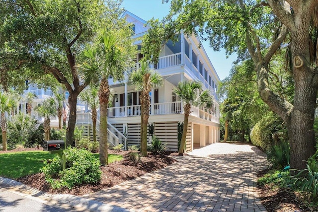 beach home with a garage and covered porch