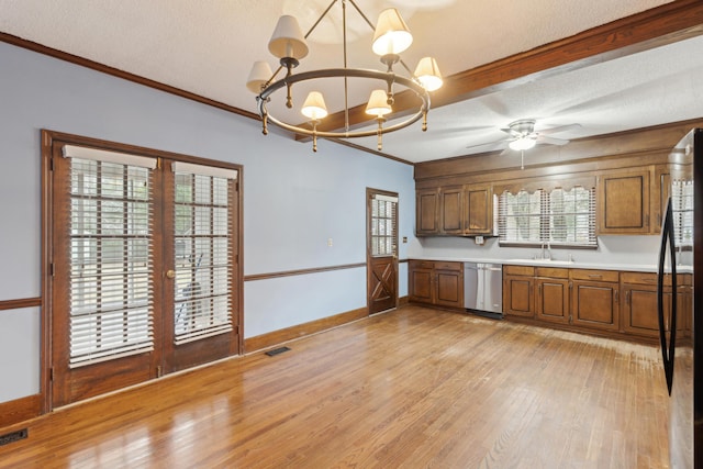 kitchen featuring light wood-style flooring, a sink, light countertops, brown cabinets, and dishwasher