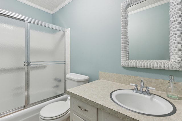 full bathroom with a textured ceiling, toilet, shower / bath combination with glass door, vanity, and crown molding