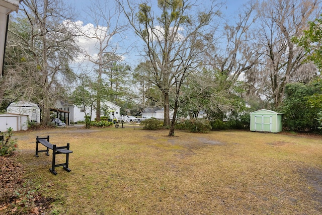 view of yard with a shed and an outdoor structure