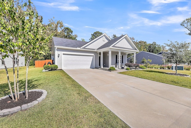 view of front of home with a front lawn and a garage