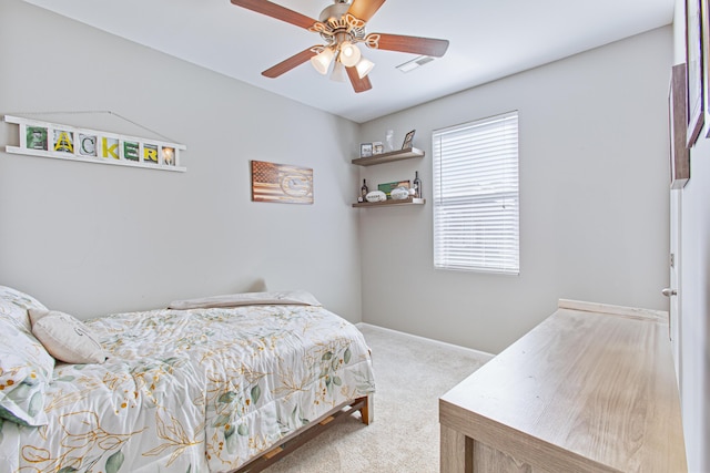 bedroom featuring carpet floors, visible vents, baseboards, and a ceiling fan