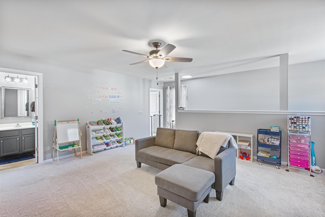 living room with light carpet and ceiling fan