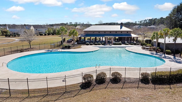 pool featuring fence and a patio