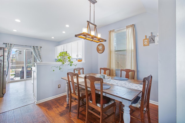 dining space featuring recessed lighting, baseboards, and wood finished floors