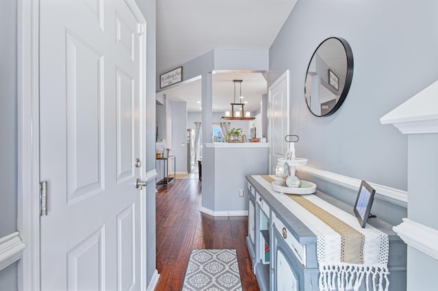 interior space with dark wood-style floors and baseboards