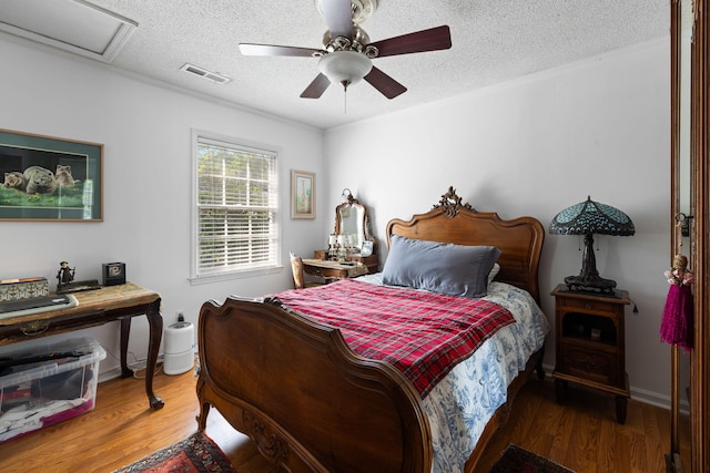 1067 Loyalist Ln, Mount Pleasant, SC 29464 - bedroom with a textured ceiling, wood finished floors, and ceiling fan