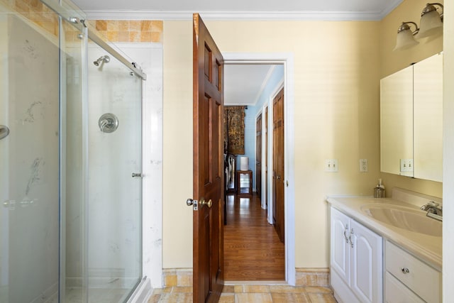 1067 Loyalist Ln, Mount Pleasant, SC 29464 - bathroom featuring ornamental molding, vanity, and a shower stall
