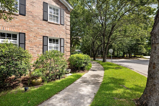 1067 Loyalist Ln, Mount Pleasant, SC 29464 - view of side of property featuring brick siding and a yard