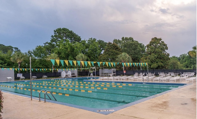 1067 Loyalist Ln, Mount Pleasant, SC 29464 - community pool with a patio area and view of wooded area