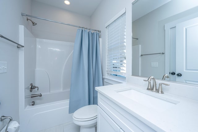 full bathroom featuring vanity, shower / tub combo, and toilet