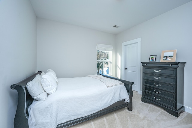 bedroom with light colored carpet