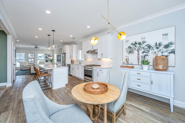 dining room featuring hardwood / wood-style flooring and a wealth of natural light