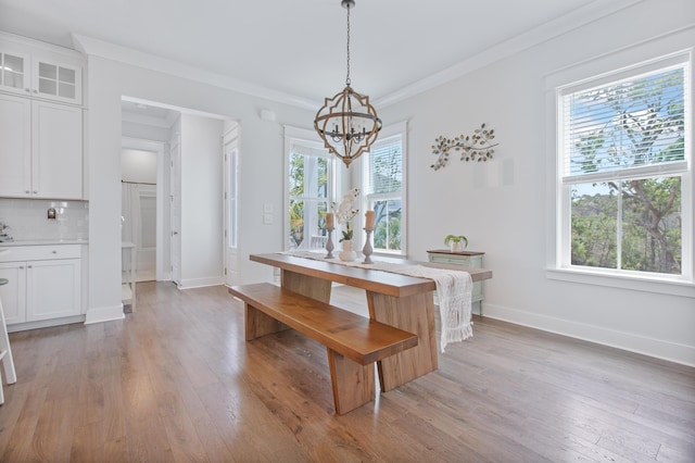 840 Forrest Dr, Charleston, SC 29492 - dining space with a chandelier, plenty of natural light, light wood finished floors, and ornamental molding