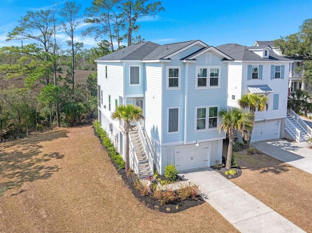 840 Forrest Dr, Charleston, SC 29492 - beach home featuring stairway, an attached garage, and driveway