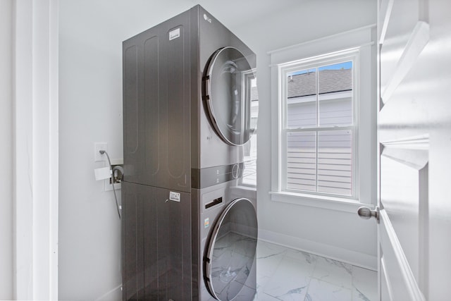 840 Forrest Dr, Charleston, SC 29492 - laundry room featuring stacked washing machine and dryer, marble finish floors, and baseboards