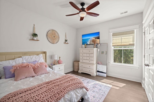 840 Forrest Dr, Charleston, SC 29492 - bedroom with wood finished floors, baseboards, and a ceiling fan