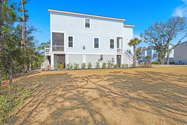 840 Forrest Dr, Charleston, SC 29492 - back of house with stairway, a sunroom, and a yard