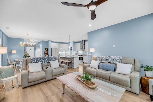 331 Saddlewood Dr, Charleston, SC 29414 - living area featuring ceiling fan, a chandelier, and light wood-style floors