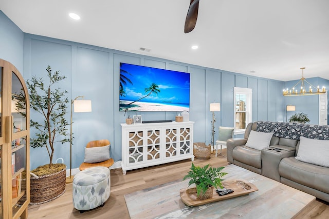 331 Saddlewood Dr, Charleston, SC 29414 - living area with a decorative wall, wood finished floors, a chandelier, and recessed lighting