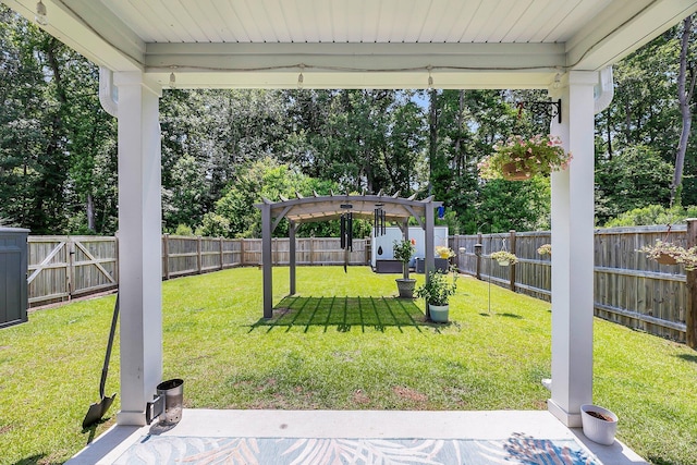 331 Saddlewood Dr, Charleston, SC 29414 - fenced backyard with a pergola, view of wooded area, and a patio