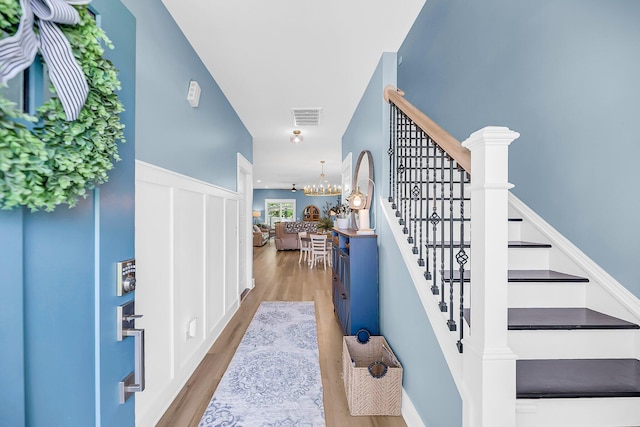 331 Saddlewood Dr, Charleston, SC 29414 - entrance foyer with stairs, wood finished floors, and a chandelier