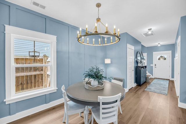 331 Saddlewood Dr, Charleston, SC 29414 - dining area with a chandelier, light wood-type flooring, and plenty of natural light