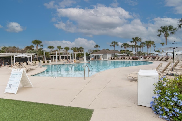 community pool featuring a patio area