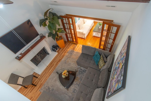 living area featuring french doors and wood finished floors
