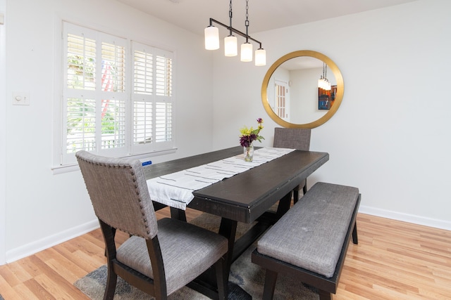 dining room with wood finished floors and baseboards