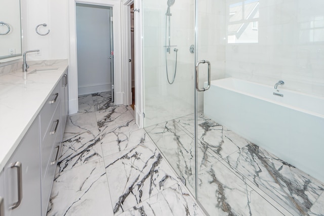 bathroom featuring vanity and shower with separate bathtub