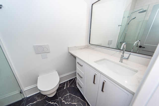 bathroom featuring vanity, toilet, and walk in shower