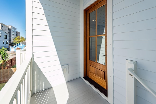 entrance to property with a balcony