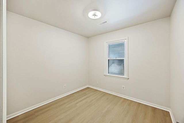 spare room featuring light hardwood / wood-style floors